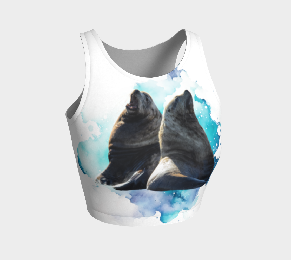 Sea Lions Communication Active Crop Top. The image on the top is of two sea lions talking to one another. The image is on a blue turquoise abstract background on a white top.