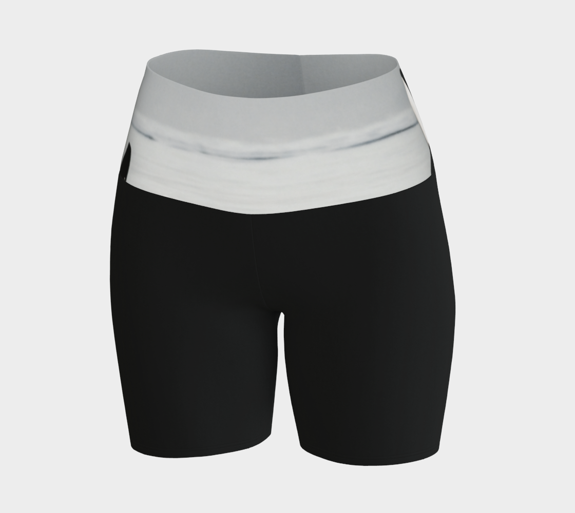 Orca spy Hop yoga shorts features an image of a orca doing the spy hop printed on the waistband. The rest of the shorts are black.