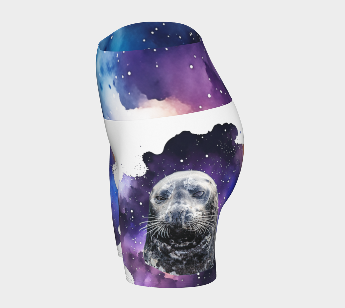 I Love Lucy Yoga shorts. All over print with a colourful celestial abstract and a image of a harbour seal named Lucy. The shorts are white with the image printed on it plus the band.