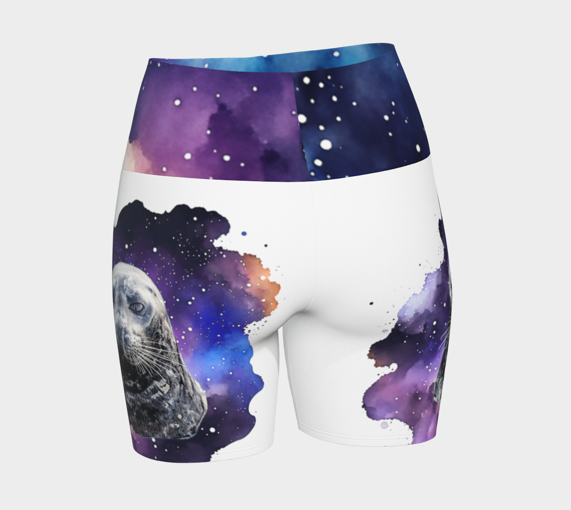 I Love Lucy Yoga shorts. All over print with a colourful celestial abstract and a image of a harbour seal named Lucy. The shorts are white with the image printed on it plus the band.