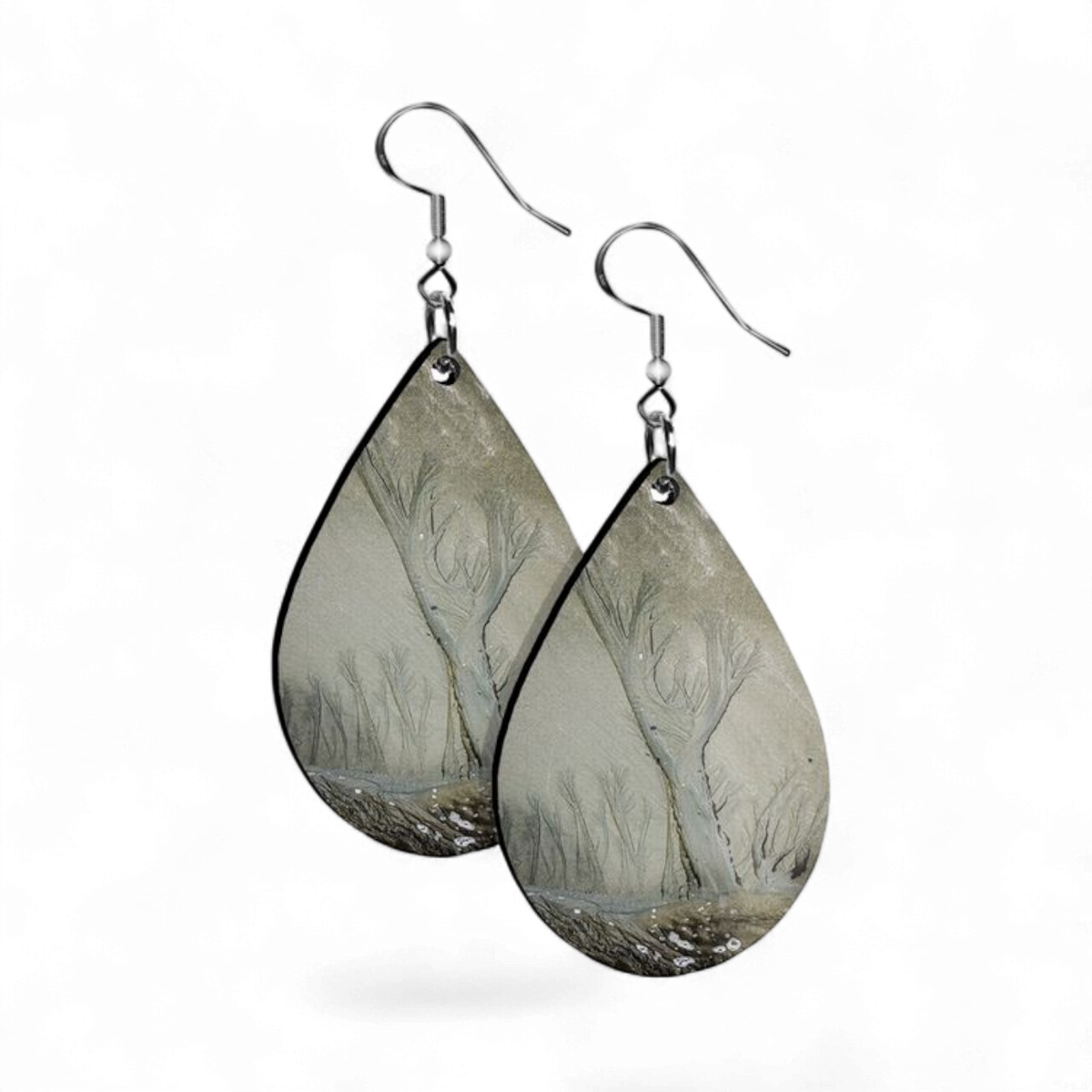 Teardrop-shaped earrings with nature-themed design on a white background