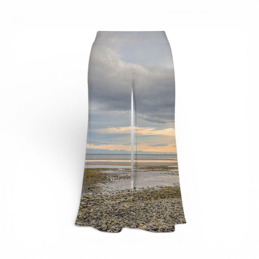 Pants with a scenic print of a sailboat on a beach