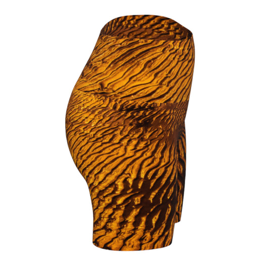 Golden Sand yoga shorts feature a image of the sand at low tide as the sun is setting it casts a golden hue across the beach. This image is printed all over the shorts.