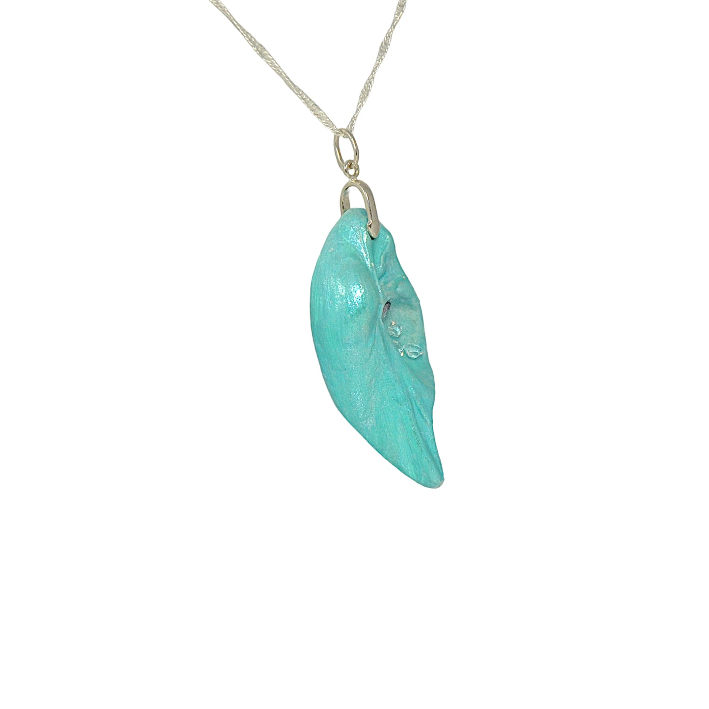 Violet Light is a natural seashell pendant with a rose cut Amethyst Gemstone and three Herkimer diamonds. The pendant is turned so the viewer can see the right side of the pendant.