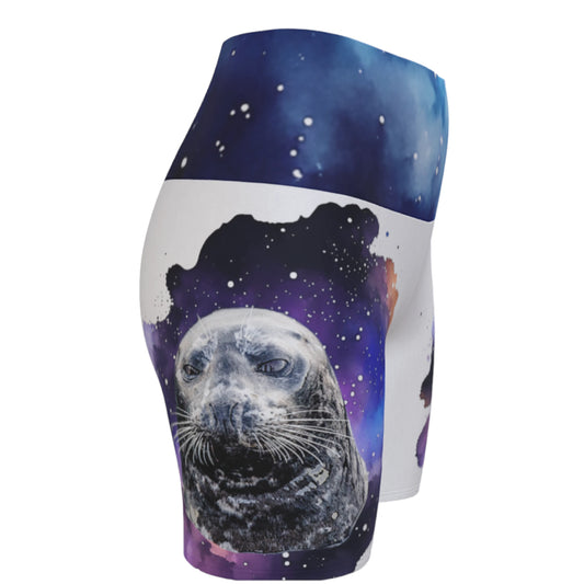 I Love Lucy Yoga shorts. All over print with a colourful celestial abstract and a image of a harbour seal named Lucy. The shorts are white with the image printed on it plus the band.
