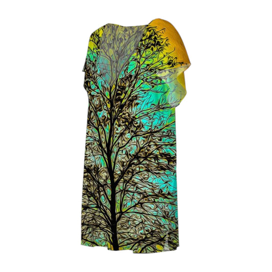 All over print dress with a print of a tree with the sun setting behind it.