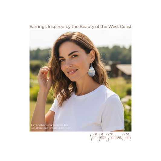 Woman wearing earrings with a scenic background, featuring Van Isle Goddess brand.