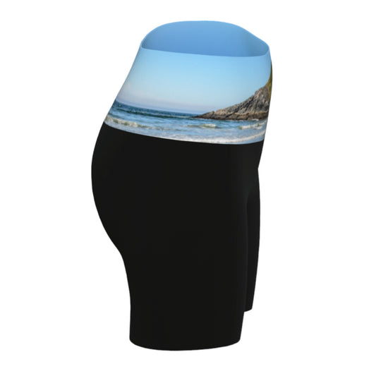 Lovekin rock long beach tofino image is printed on the waist band of the yoga shorts. The rest of the shorts is black.