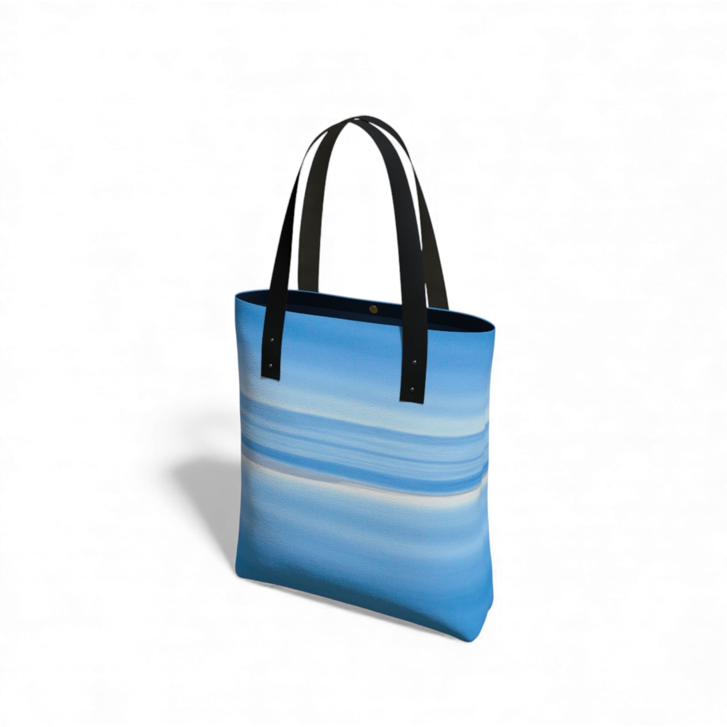 Tote bag with blue ocean horizon design on a white background