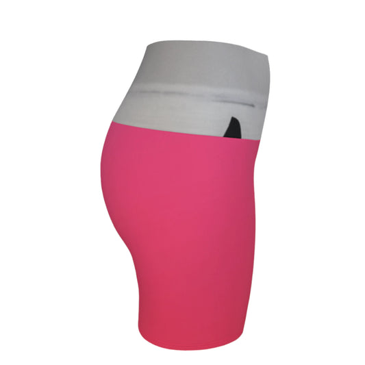 The image Orca spy hop is printed on the waistband of the yoga shorts. The rest of the shorts is pink.
