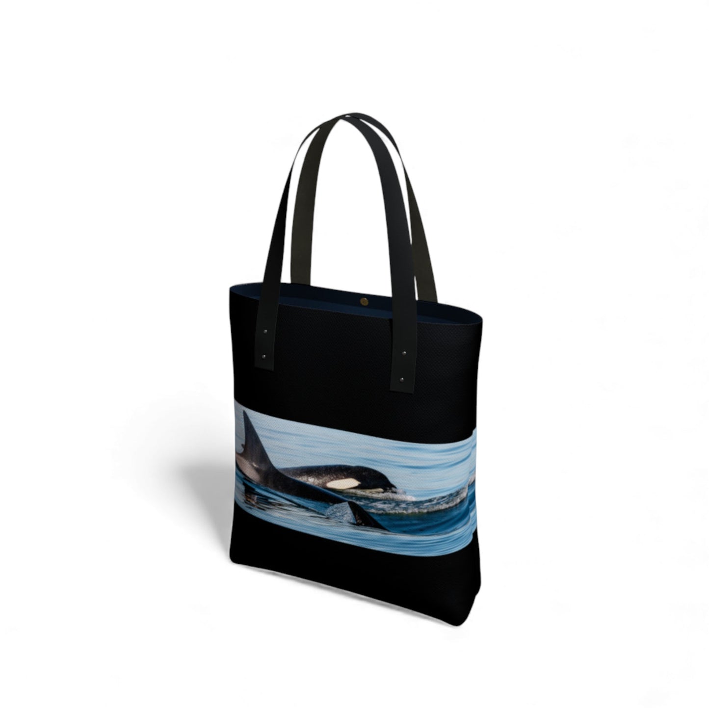 Tote bag with an orca whale design on a black background