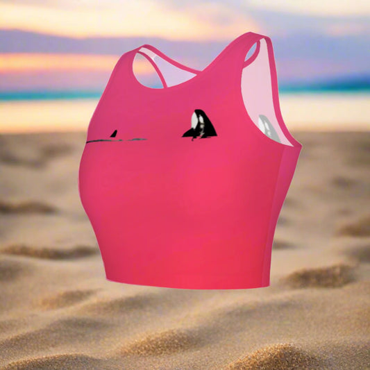 Orca spy hop active crop top. It is pink with a simple image of a orca in the spy hop position.