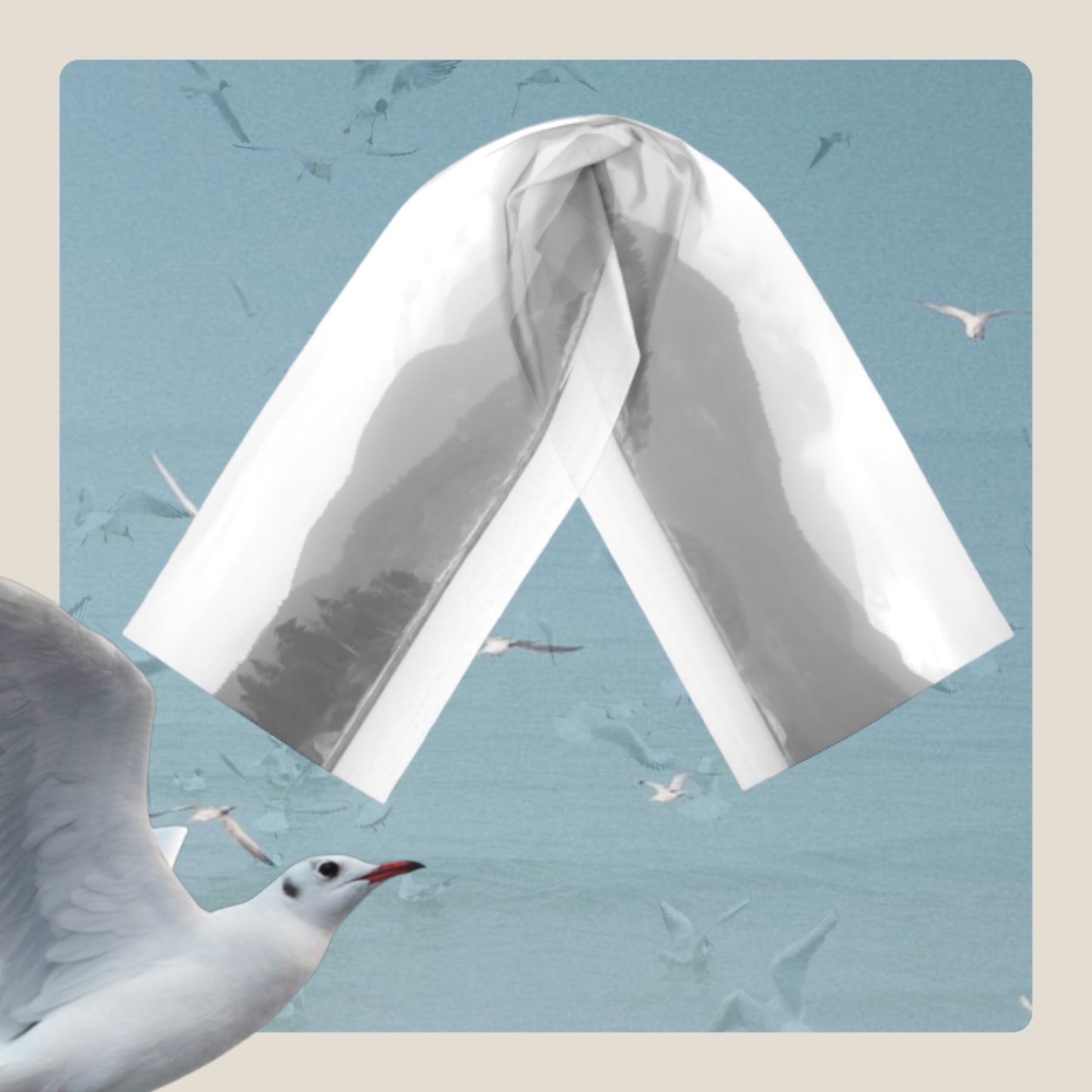 Pacific Mist long scarf is shown with background of seagulls.