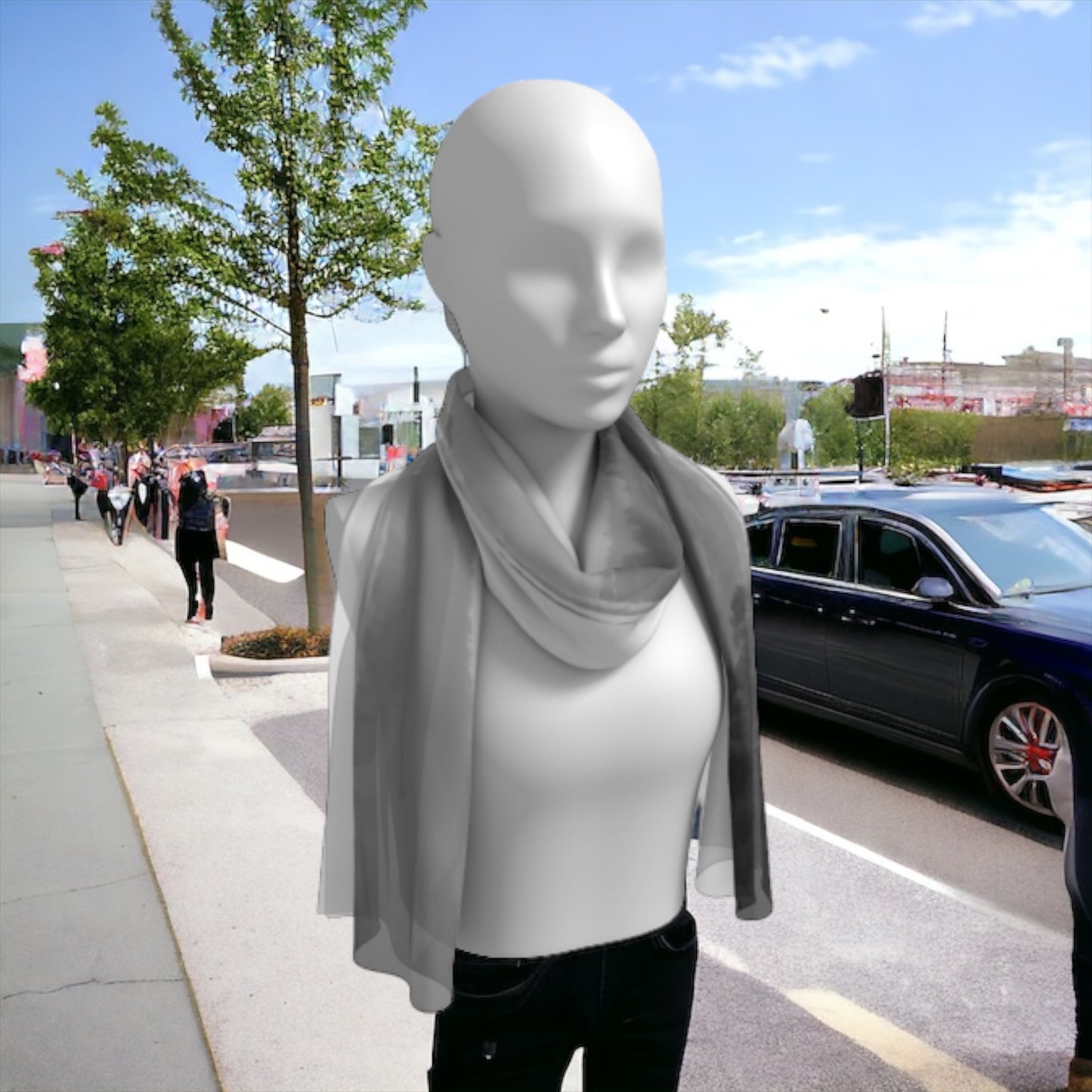 Pacific Mist long scarf is shown worn around the neck.