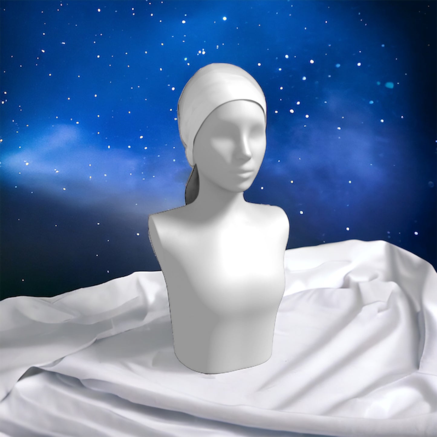 Pacific Mist long scarf is shown worn as a head wrap with a starry background.