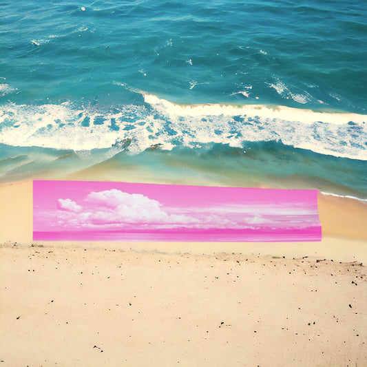 Parksville Beach long scarf is shown in its full length on a bed of sand at the beacj.