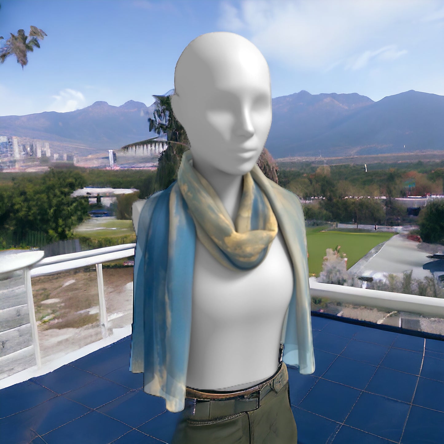 Qualicum beach long scarf is shown worn around the neck.
