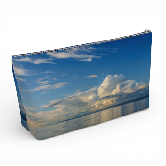 Pouch with a design of a blue sky and clouds on a white background