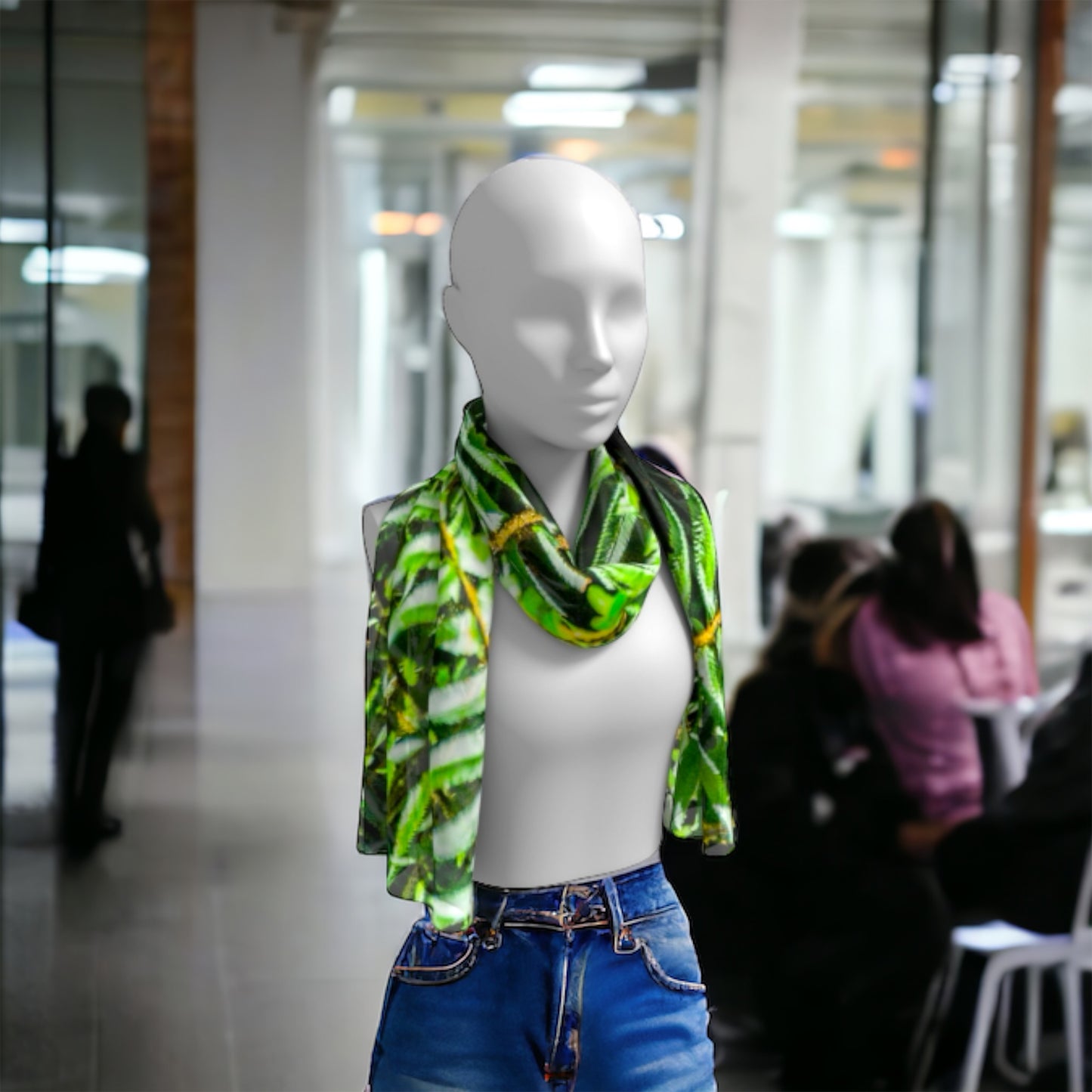 Rainforest long scarf is shown worn around the neck.