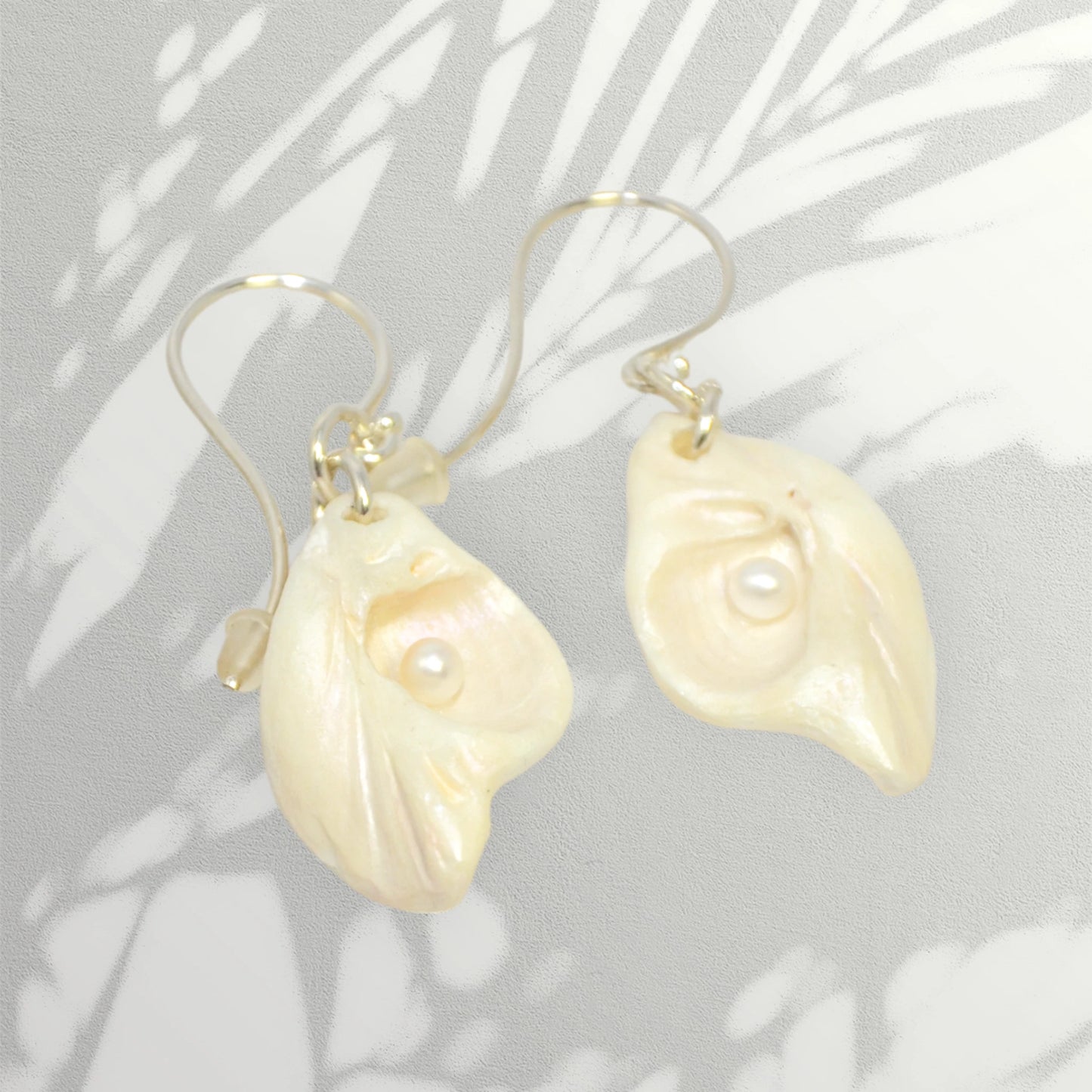 Serenity natural seashell earrings with real baby freshwater pearls.