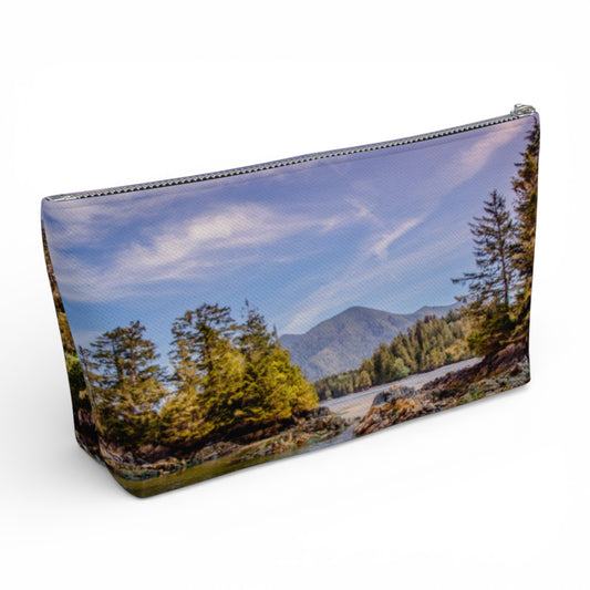 Pouch with a scenic design of trees and mountains on a white background
