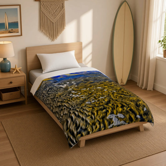 A single bed in a sunlit bedroom with a colorful abstract-patterned comforter in yellow, black, blue, and white. The room includes a wooden headboard, beige walls, a surfboard leaning against the wall, a bedside lamp, and a woven rug.