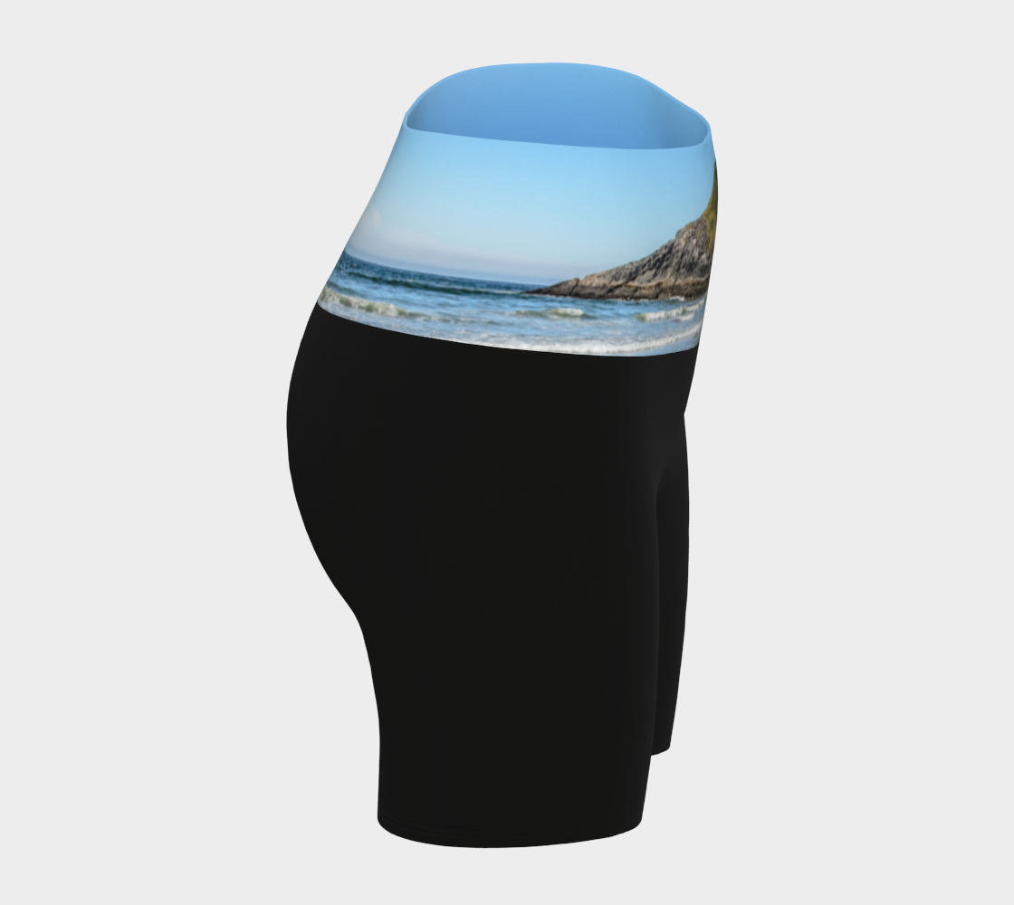 Lovekin rock long beach tofino image is printed on the waist band of the yoga shorts. The rest of the shorts is black.