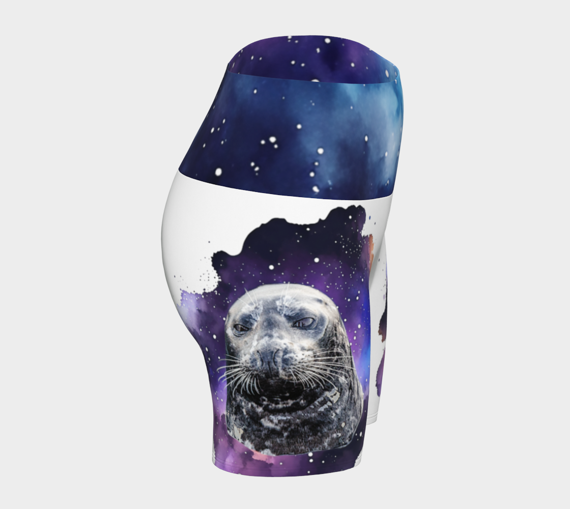 I Love Lucy Yoga shorts. All over print with a colourful celestial abstract and a image of a harbour seal named Lucy. The shorts are white with the image printed on it plus the band.