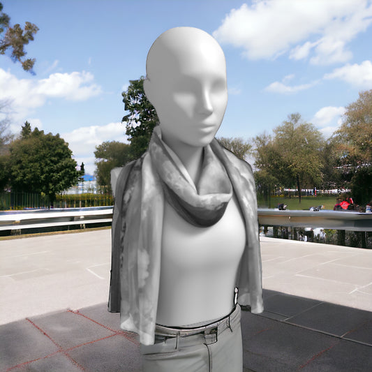 Parksville beach long scarf is shown worn around the neck.