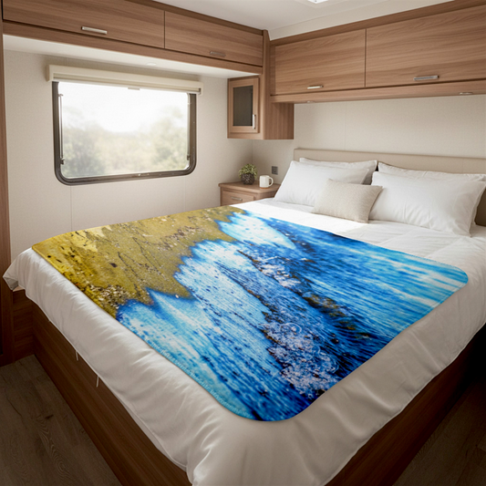 Van Isle Goddess beach wave blanket in blue and tan, made of soft minky fabric with a photographic print.