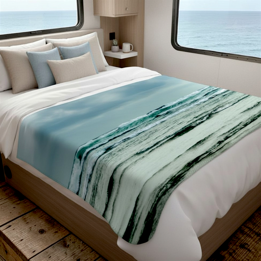 Van Isle Goddess Ocean Calling Long Beach Tofino Coastal Blanket, featuring rolling waves and a cloudy sky. Made of soft polyester minky fabric.