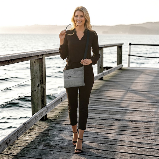 Van Isle Goddess Long Beach Tofino vegan leather crossbody purse with adjustable strap and zipper closure.