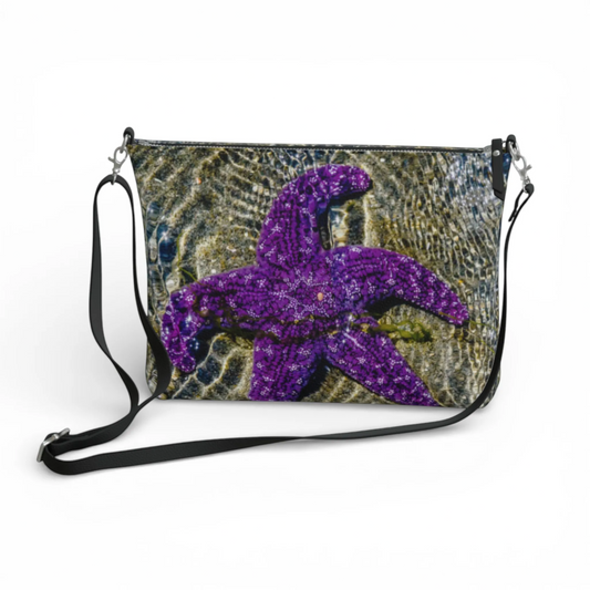 Van Isle Goddess purple starfish vegan leather crossbody purse with adjustable strap and metal hardware.