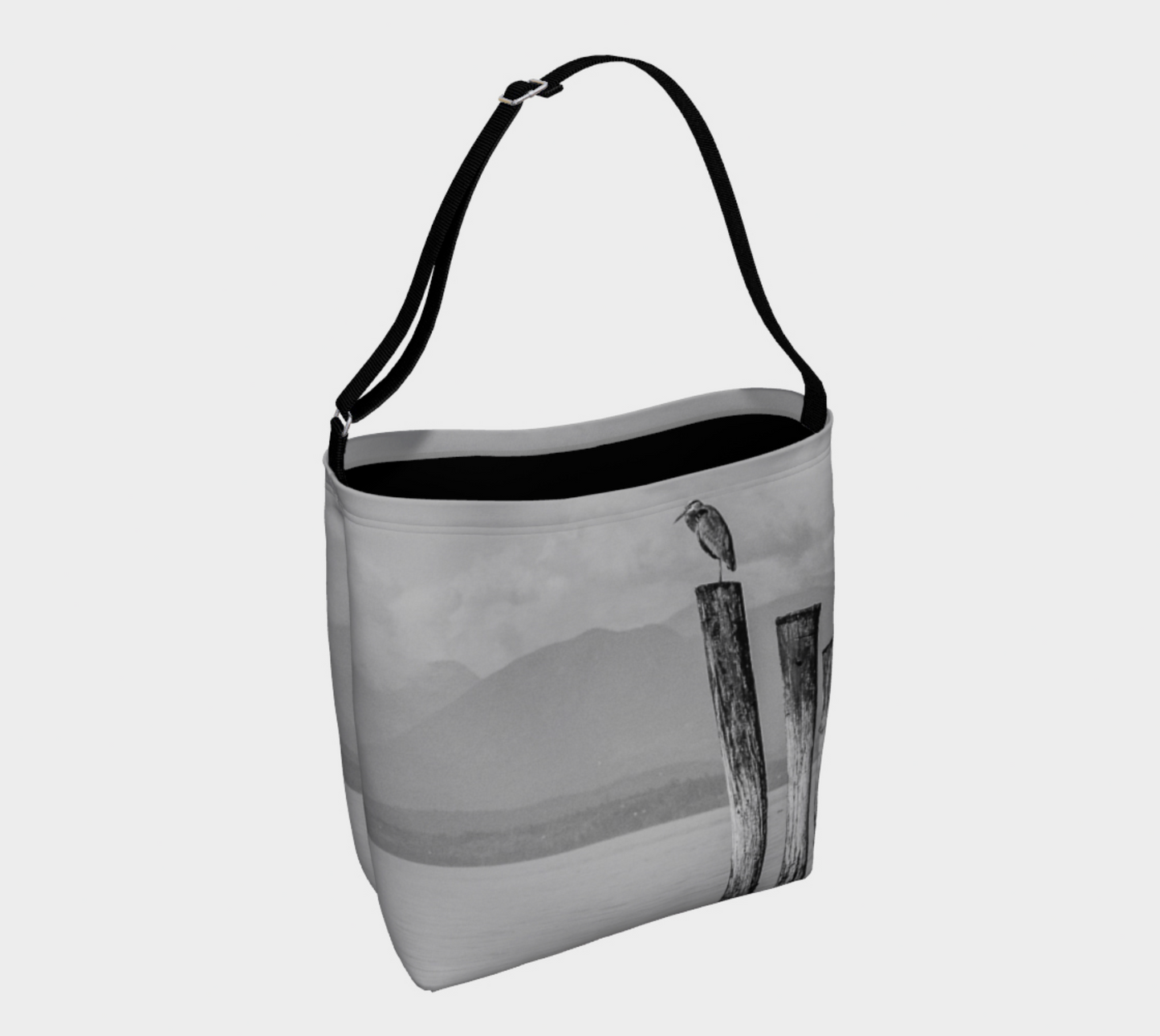 The image on this tote bag is of a blue heron atop a pole overlooking the strait in Campbell River on Vancouver Island.