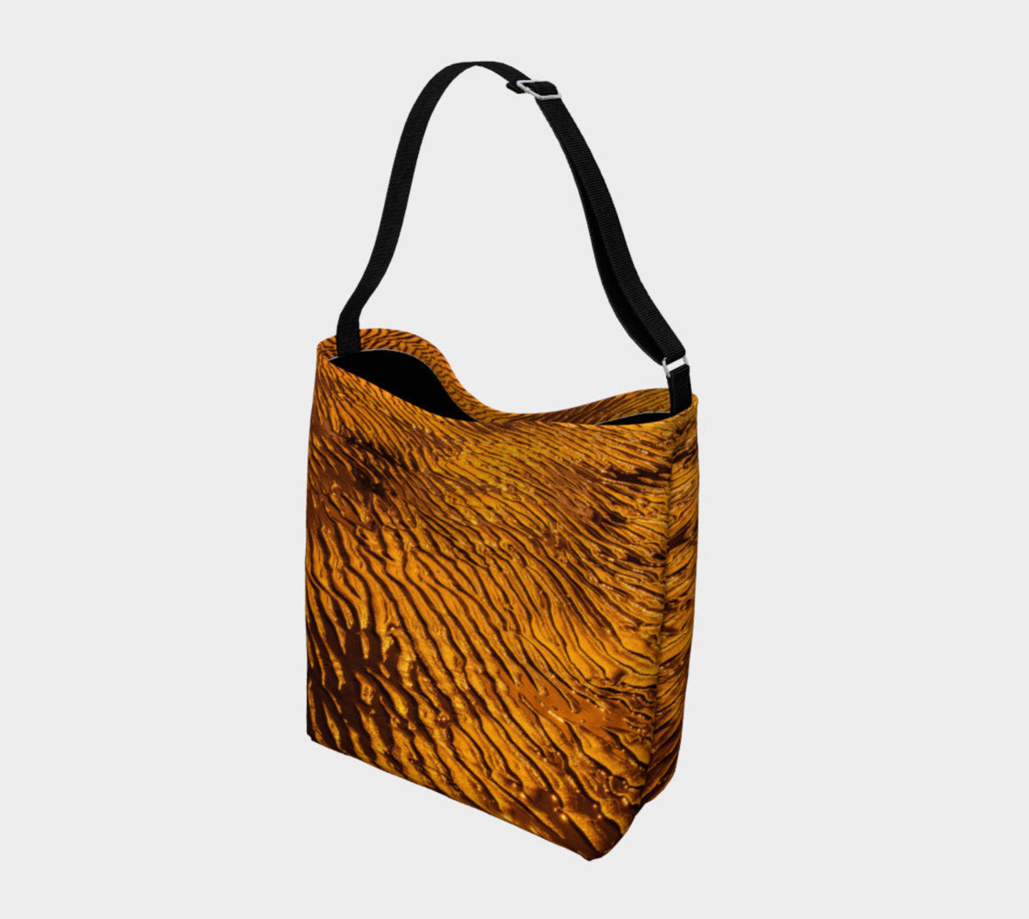 Golden Sand Day Tote Everyday Day Tote for Everything! Van Isle Goddess ultimate tote bag! Adjustable strap for comfort, the tote is made from soft and supple neoprene that stretches to fit whatever you can put in it! Vibrant artwork that will never fade with washing. Golden Sand Artwork by Roxy Hurtubise with golden sand artwork printed on the bottom interior with a black band on the interior top.