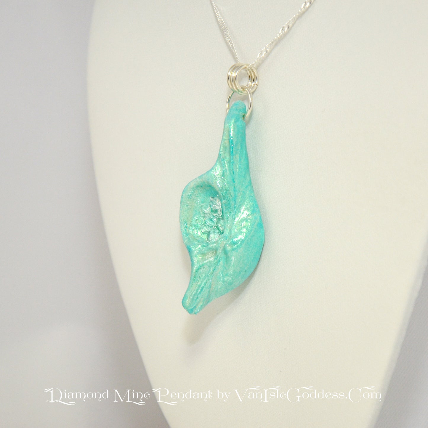 Diamond Mine Pendant is named for the eight herkimer diamonds that enhance the beauty of this gorgeous pendant! The pendant is turned so the viewer can see it.