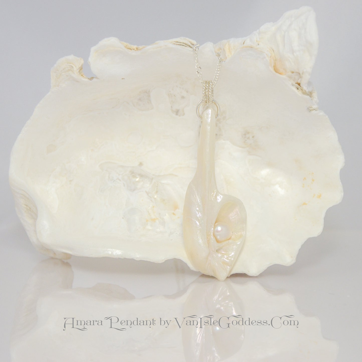 Amara is the name of this one of a kind pendant made from a natural seashell from the beach of Vancouver Island. The pendant has a real freshwater pearl.
