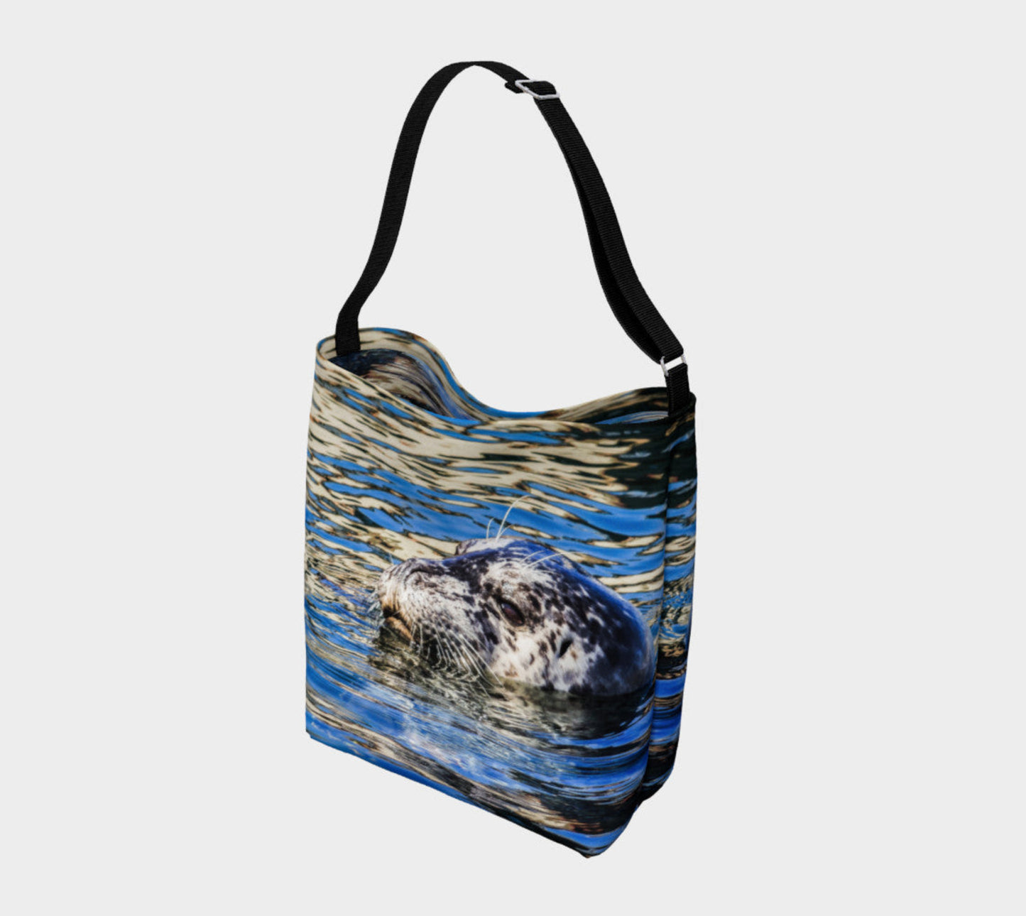 Seal of Blue Day Tote Everyday Day Tote for Everything! Van Isle Goddess ultimate tote bag! Adjustable strap for comfort, the tote is made from soft and supple neoprene that stretches to fit whatever you can put in it! Vibrant artwork that will never fade with washing. Seal of Blue Artwork by Roxy Hurtubise with blue interior.