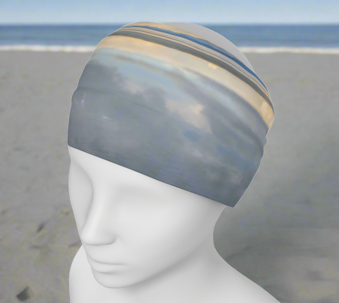 Light Language Parksville Beach Headband neck gaiter. the image is of parksville beach in the early morning and the ocean was so calm it looked like glass. soft colours.