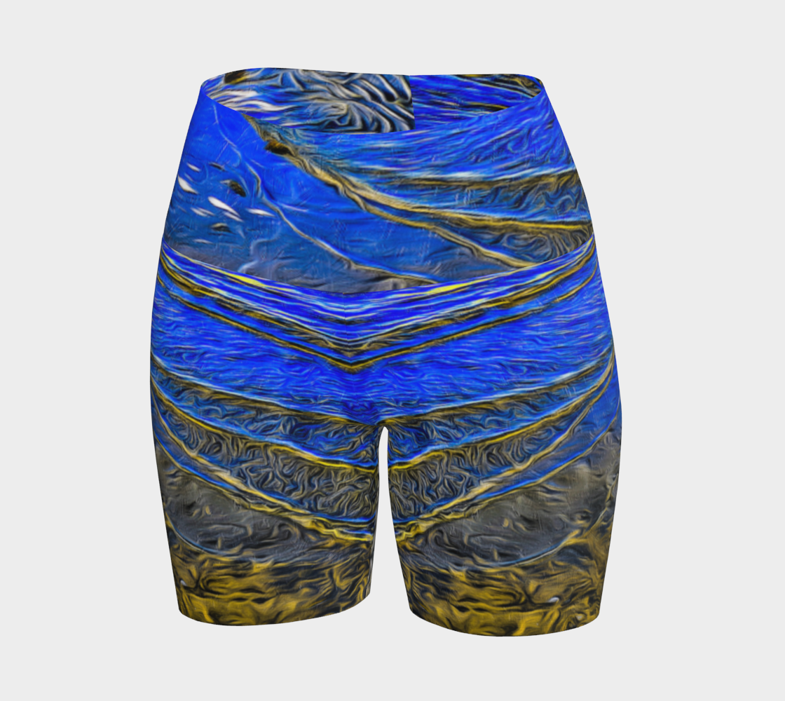 Ebb and Flow All over print yoga shorts.  The shorts feature a image of the ocean water at low tide on Parksville Beach.  the blue sky and the sun is reflecting on the water as the waves gently ripple across the sand.  A painterly effect was added to create a artistic effect.
