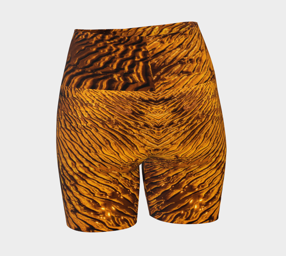 Golden Sand yoga shorts feature a image of the sand at low tide as the sun is setting it casts a golden hue across the beach. This image is printed all over the shorts.