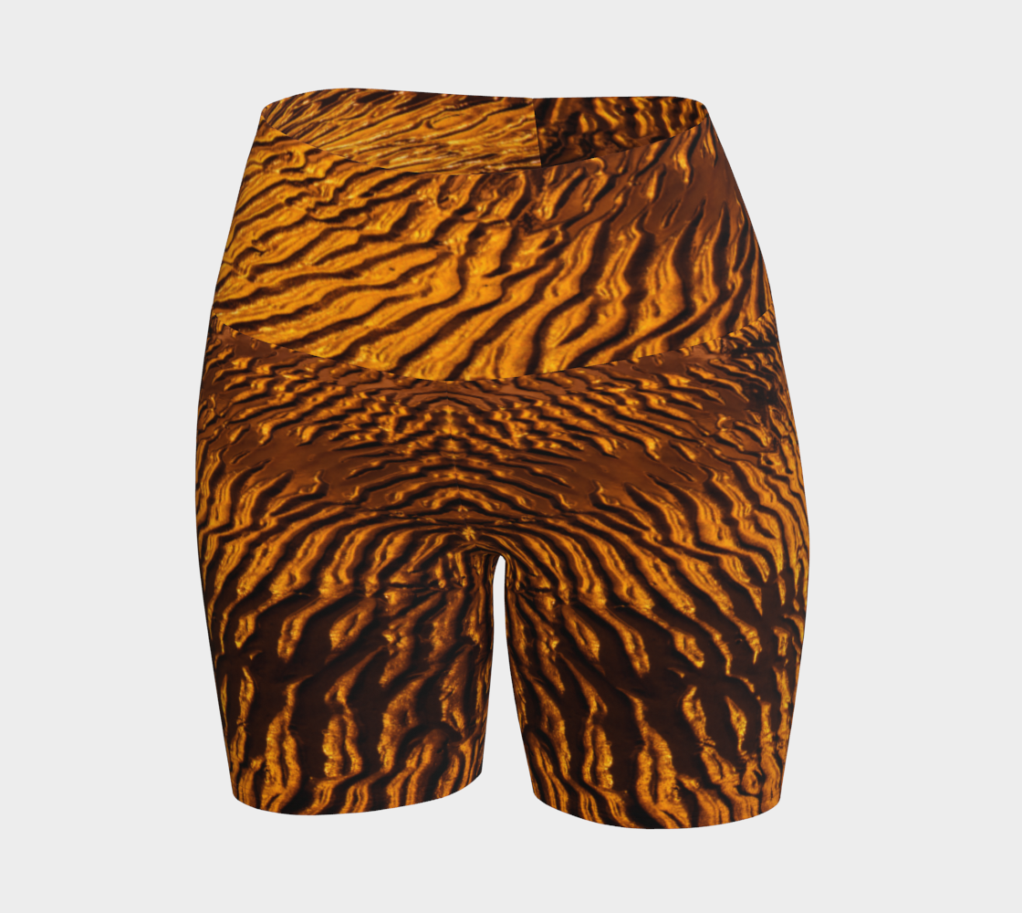 Golden Sand yoga shorts feature a image of the sand at low tide as the sun is setting it casts a golden hue across the beach. This image is printed all over the shorts.