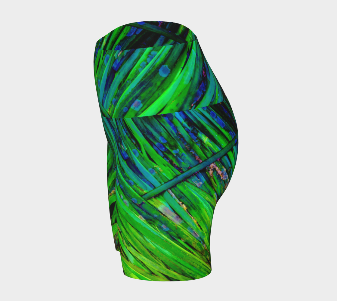 Shades of green yoga shorts feature an all over print of spring ocean sea grass at low tide.