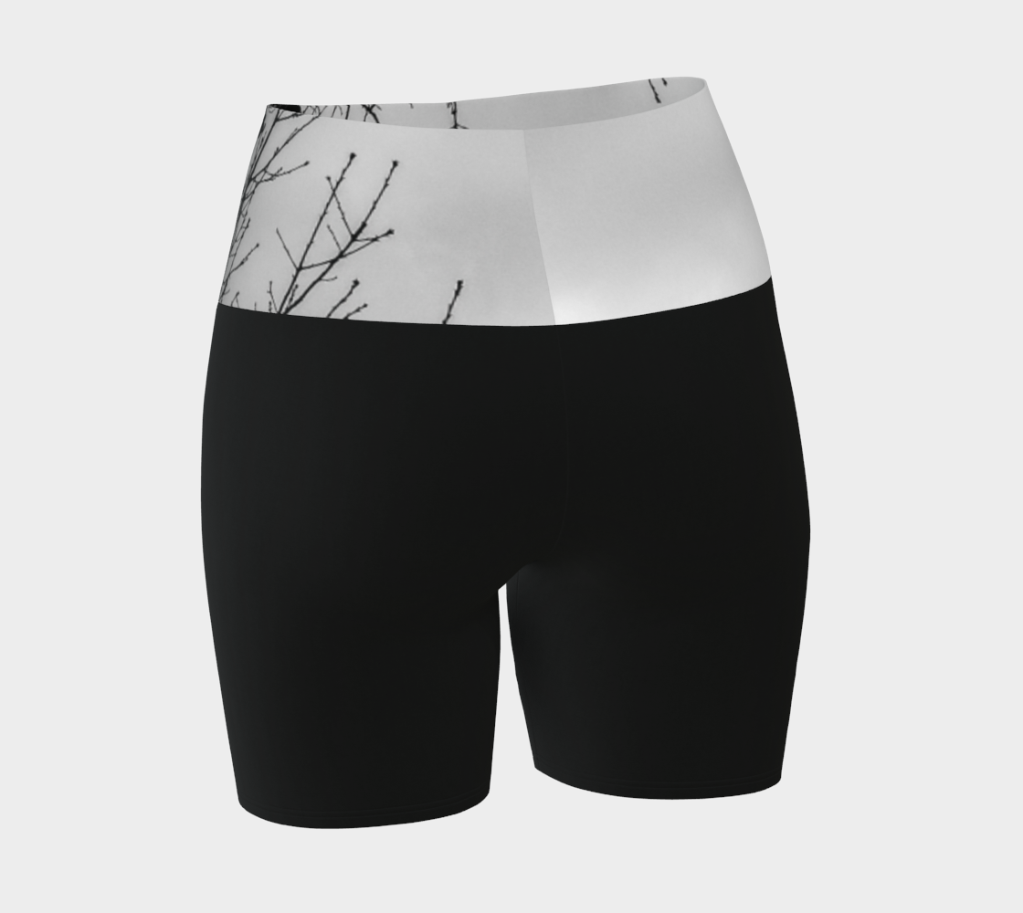 Crows Yoga Shorts feature a photograph of crows sitting in a tree printed on the band of the yoga shorts. The bottom of the yoga shorts are black.
