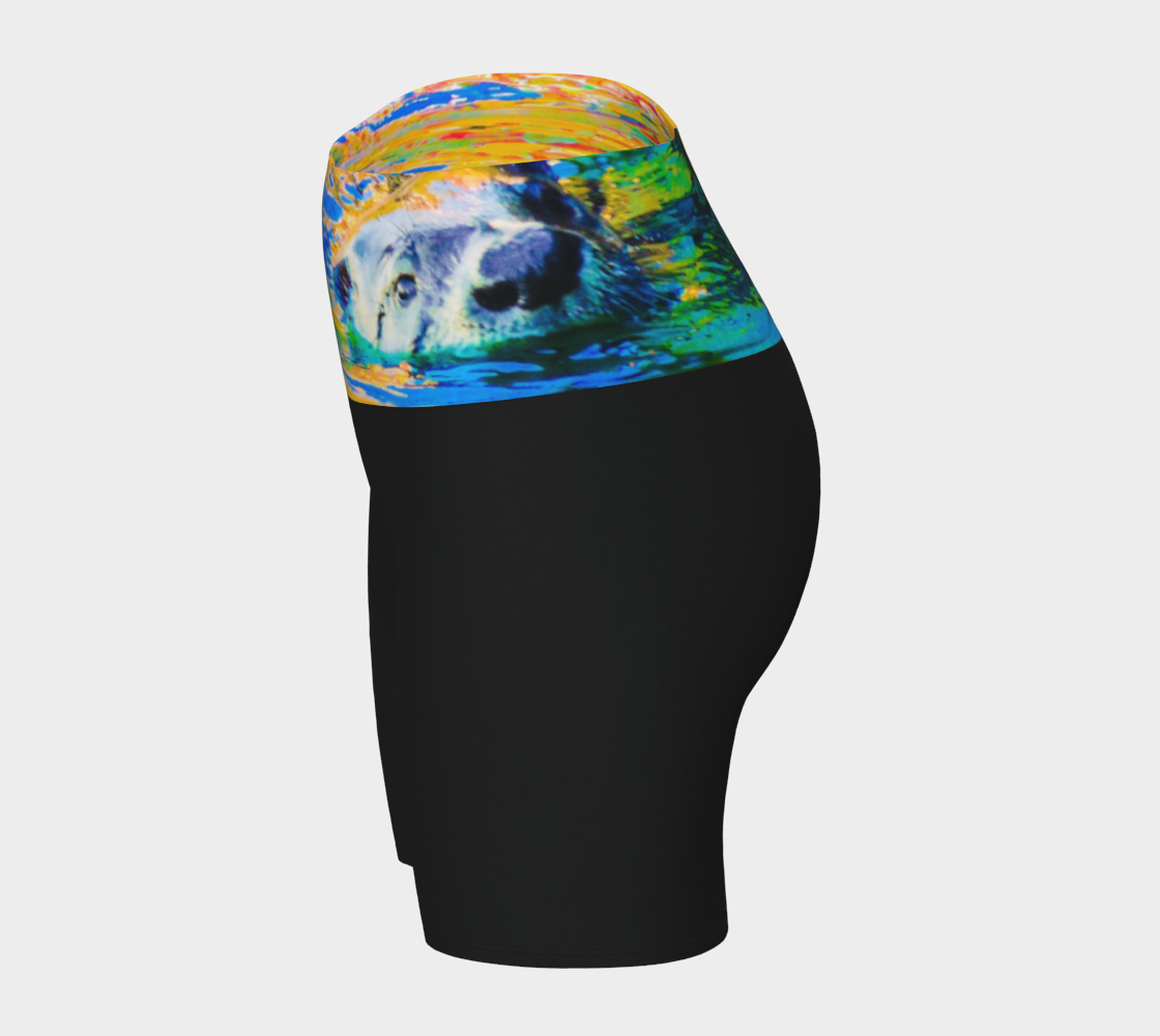 Otter Art Yoga Shorts feature a image of a sea otter printed on the waistband. The rest of the shorts are black.