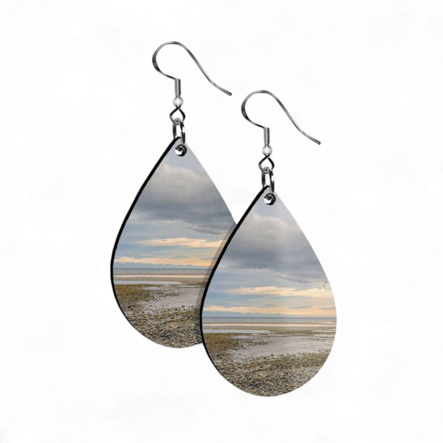 Teardrop-shaped earrings with beach scene design on a white background
