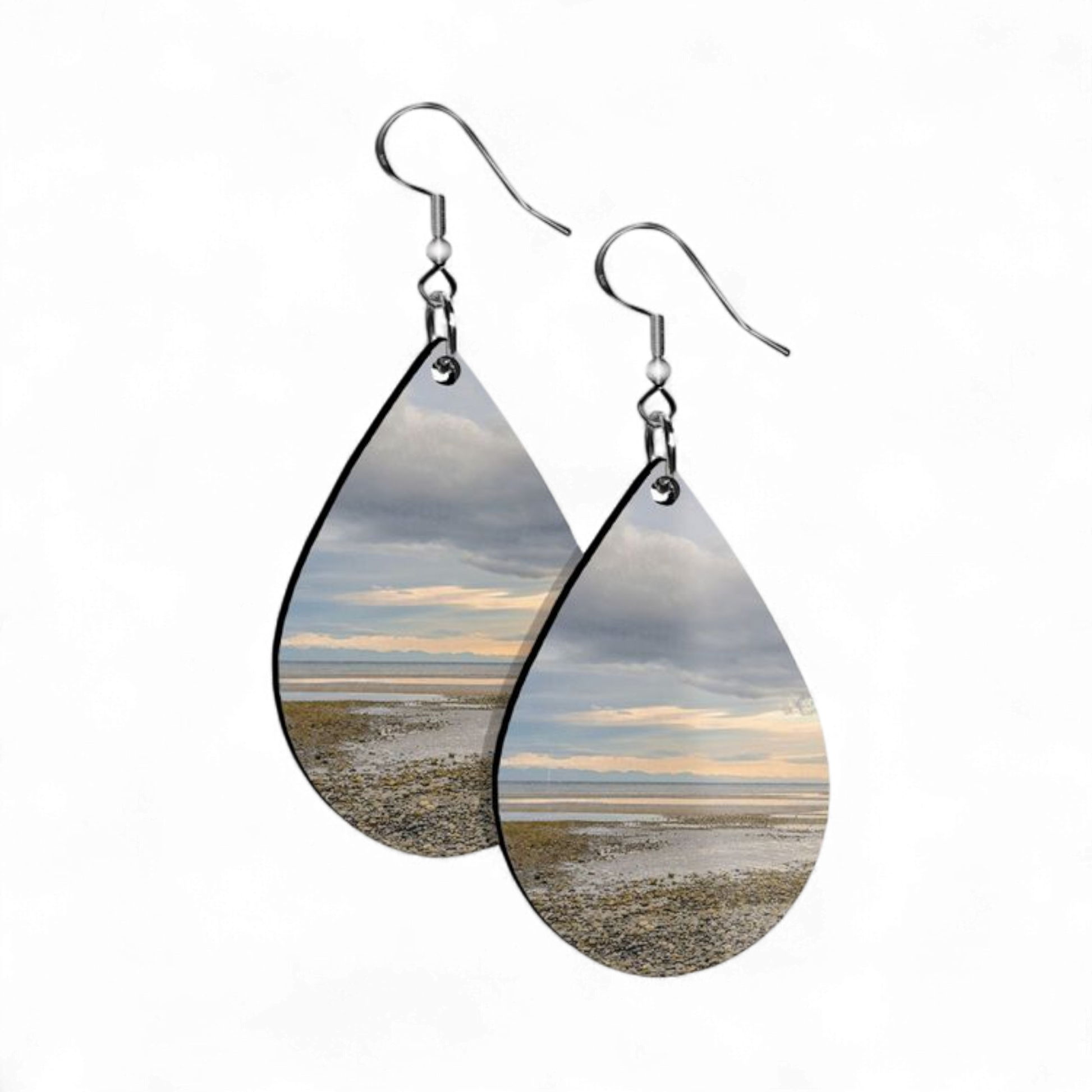 Teardrop-shaped earrings with beach scene design on a white background