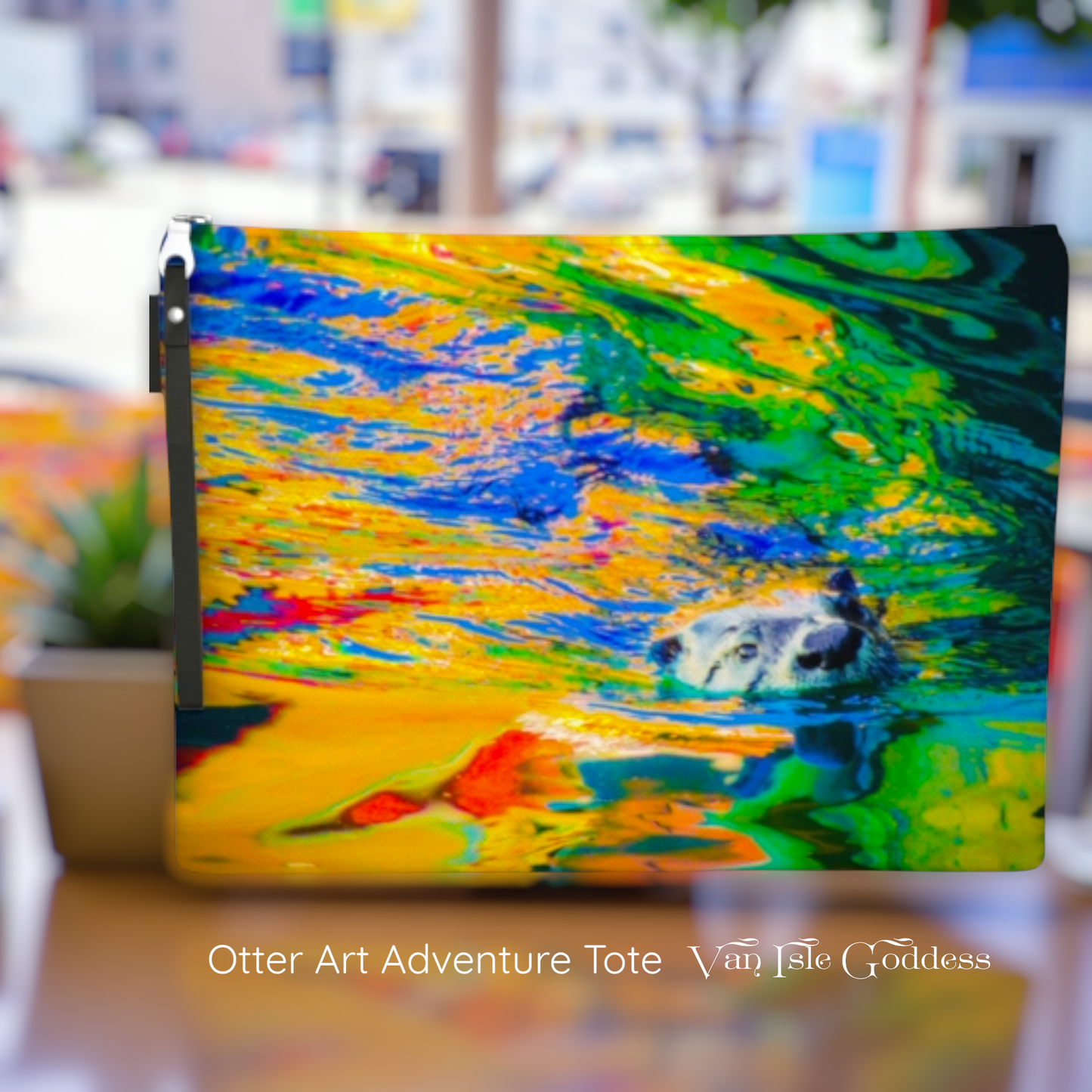 Colorful otter art adventure tote with blurred outdoor background