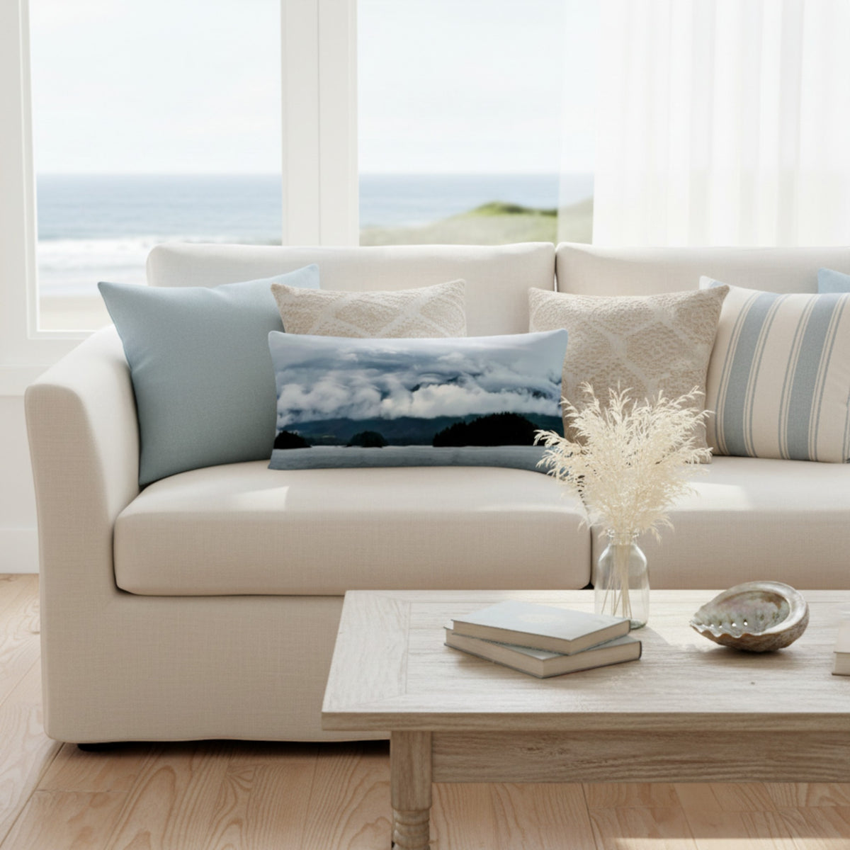 Sofa with a variety of beach themed pillows.