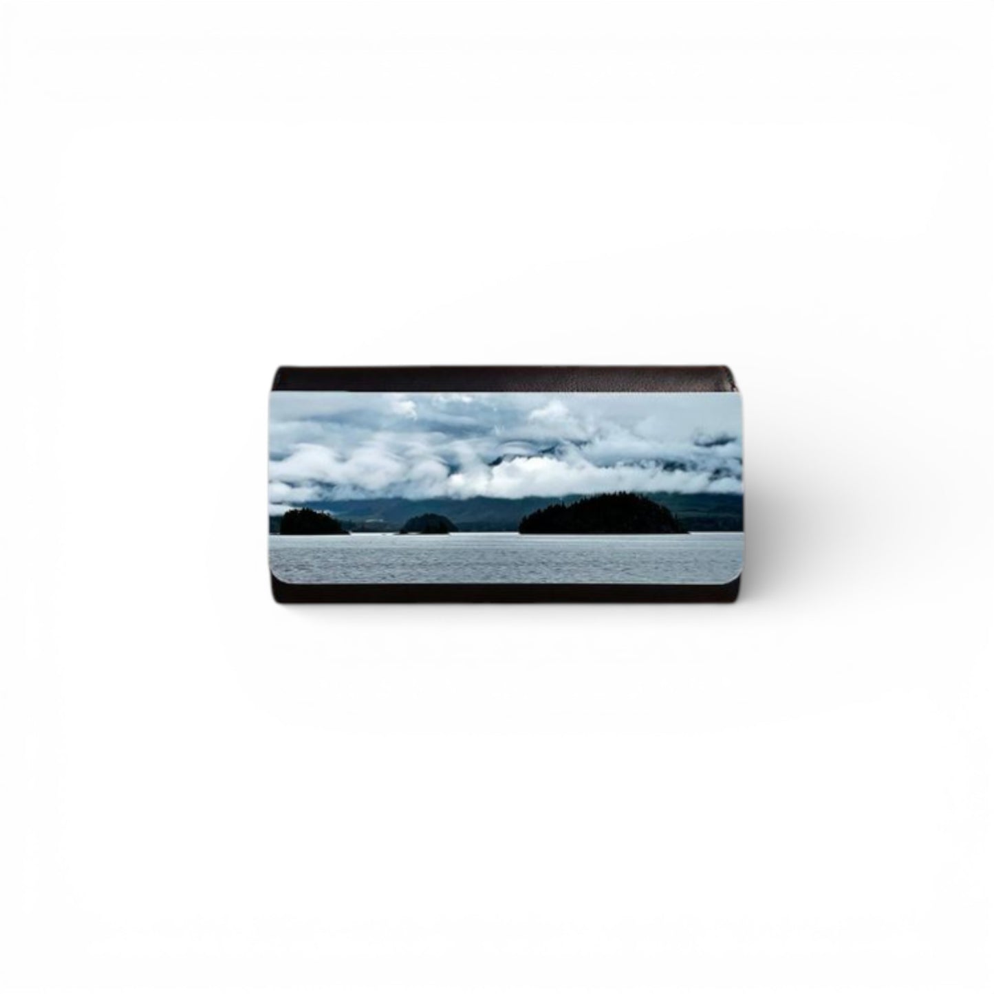 Rectangular object with a scenic design of mountains and clouds on a white background